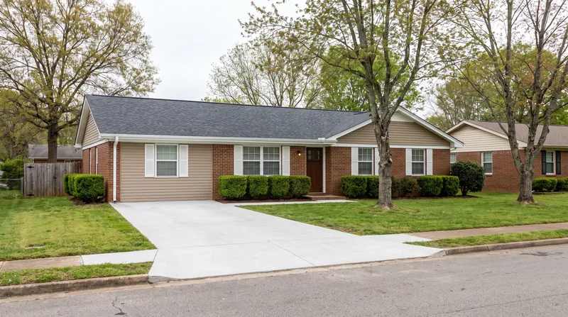 Kept comparable: a renovated brick ranch with a new roof and driveway